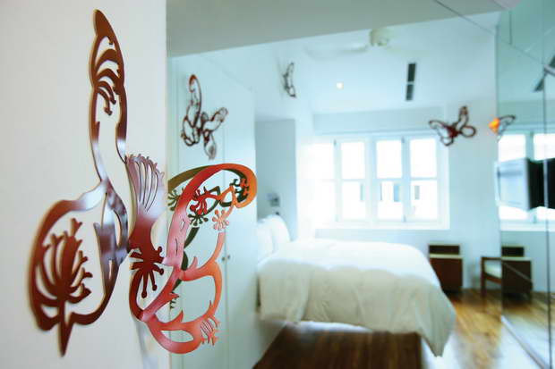 butterflies on the wall decoration,designer boutique hotel rooms,hotels in singapore,best design hotels asia,modern white bedroom ideas,