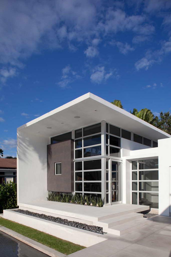 florida architecture style,contemporary glass window designs,geometric house plans,house with many windows,white colored house,