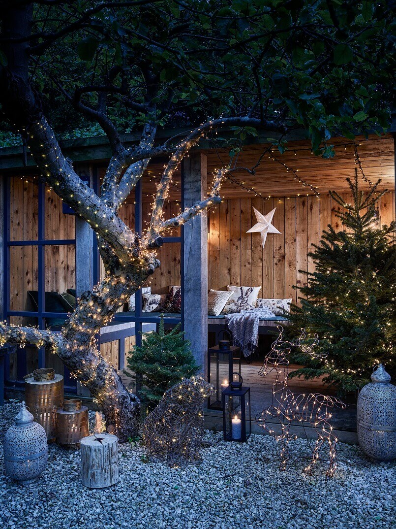 Christmas lights outdoor,outdoor holiday lighting ideas,light your garden for holidays,light up tree in garden,decorate outdoor living space for Christmas,