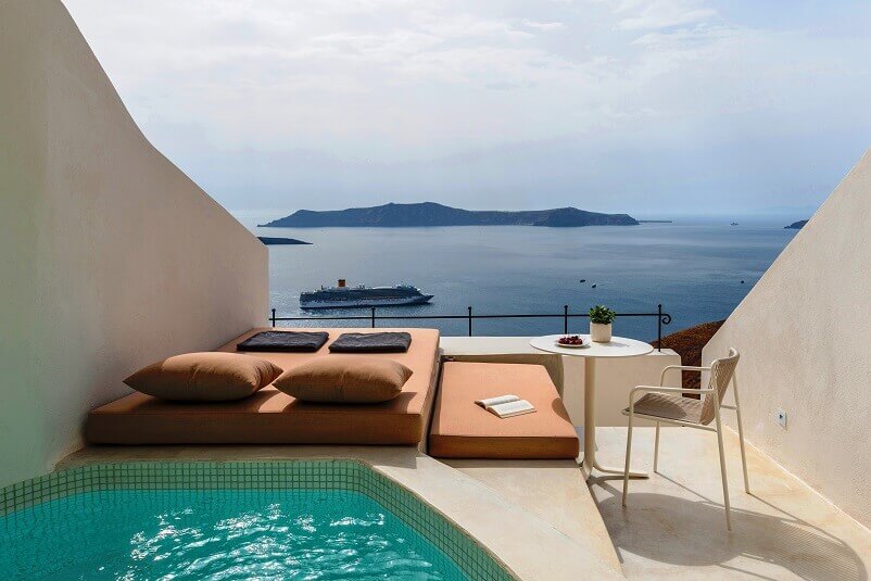 terrace with sea view,enigma suites santorini greece,hotel room terrace design,romantic holidays for couples,romantic travel destinations europe,