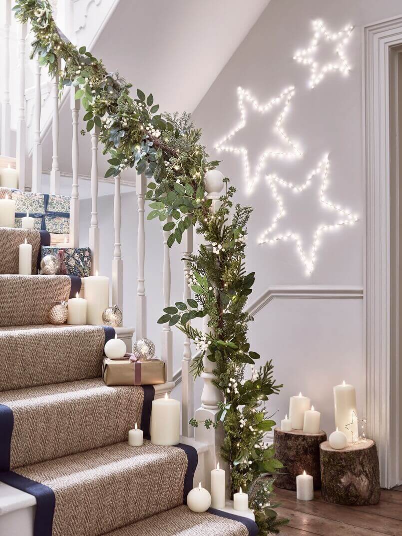 gift boxes and led candles decoration,light stars for wall,Christmas stair decorations with lights,staircase and hallway holiday decorating ideas,holiday gifts as decorations,