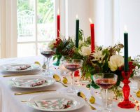 red and green table decorations,table decoration ideas by designers for table settings,green and red candle holders,holly themed centerpiece ideas for dining room,Christmas table decorations ideas,
