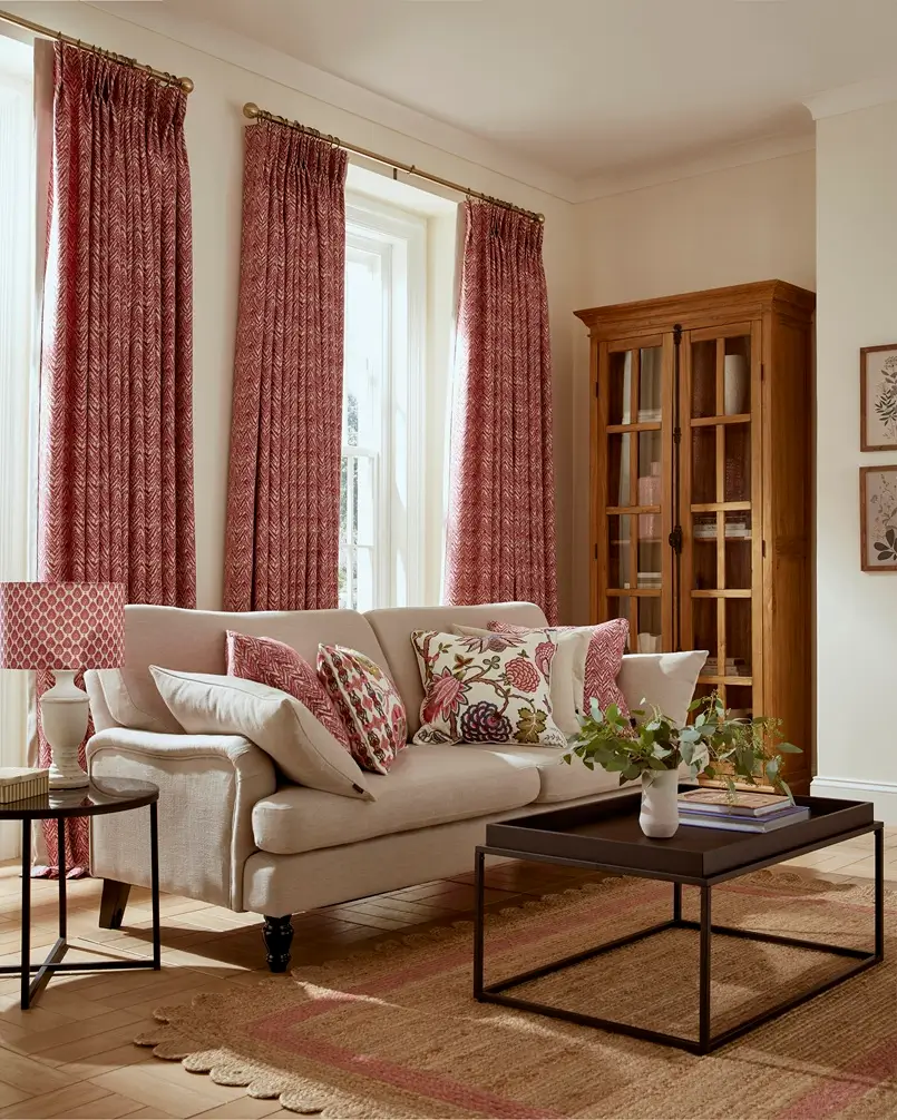 living room design with red curtains and colorful cushions on the sofa, archi-living.com
