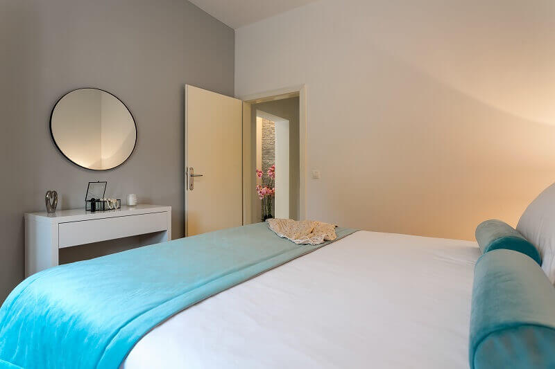 white gray blue bedroom,relaxing bedroom interior design,round mirror modern,apartments stipisic,visit hvar island,