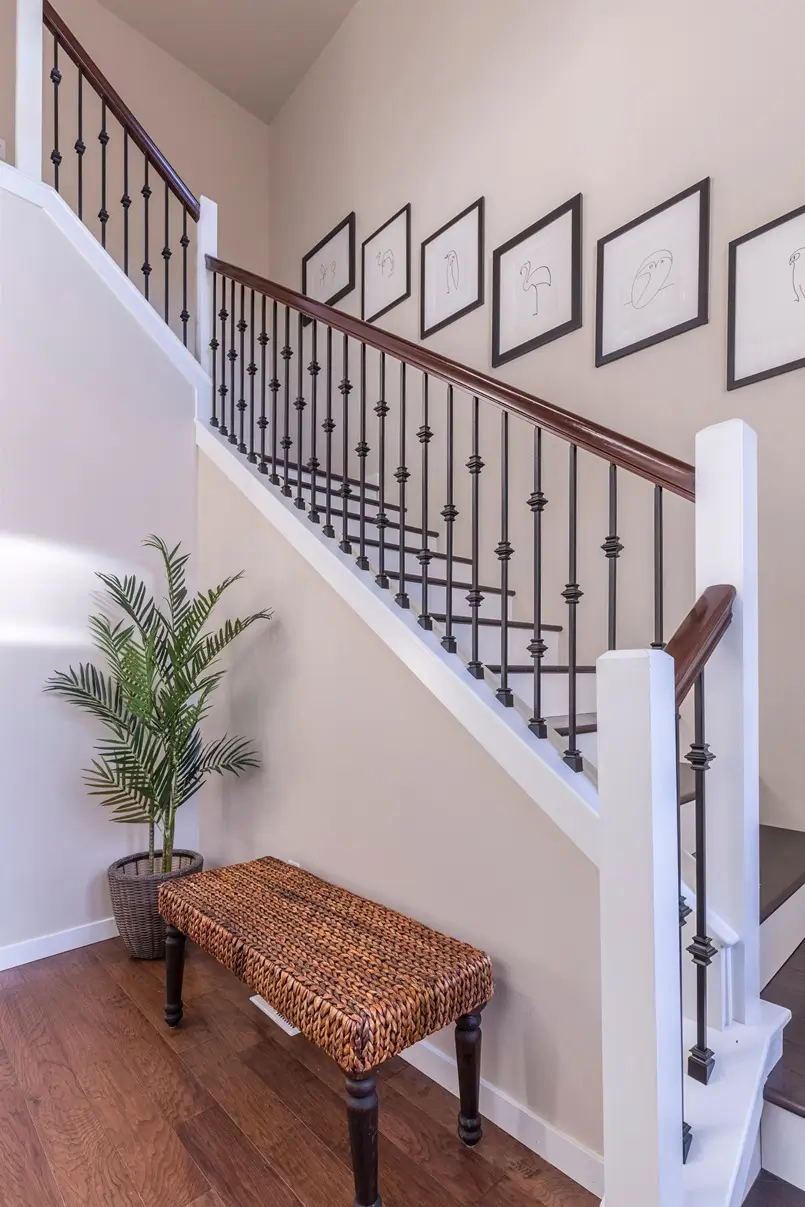 staircase design with wood and iron fence, photo by Francesca Tosolini on Unsplash, Archi-living.com