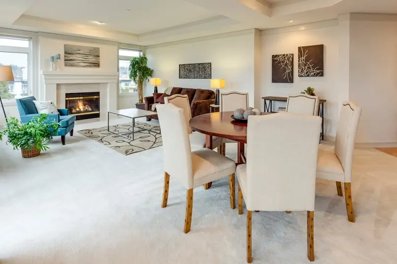open space dining and living room with fireplace, photo by Francesca Tosolini on Unsplash, Archi-living.com