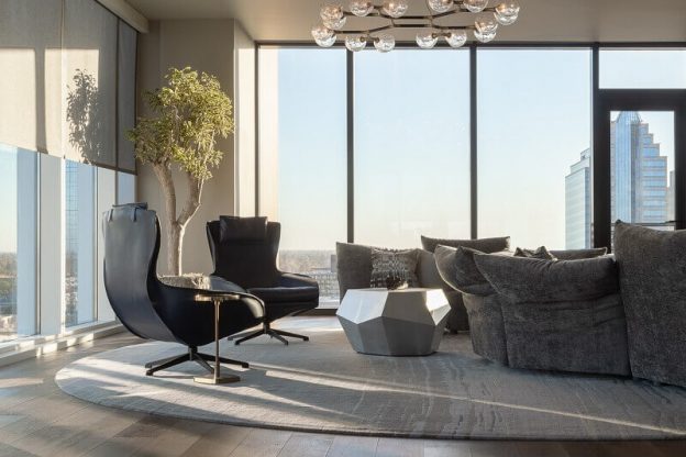 penthouse interior design,decorating living room with a view,penthouse in sacramento,Mario Bellini lounge chairs,brabbu horus suspension light,