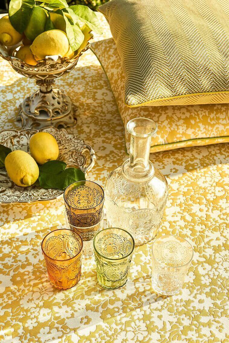 white and yellow tablecloth floral,spring floral tablecloths,lemons on table,yellow and green combination,yellow and green table decorations,